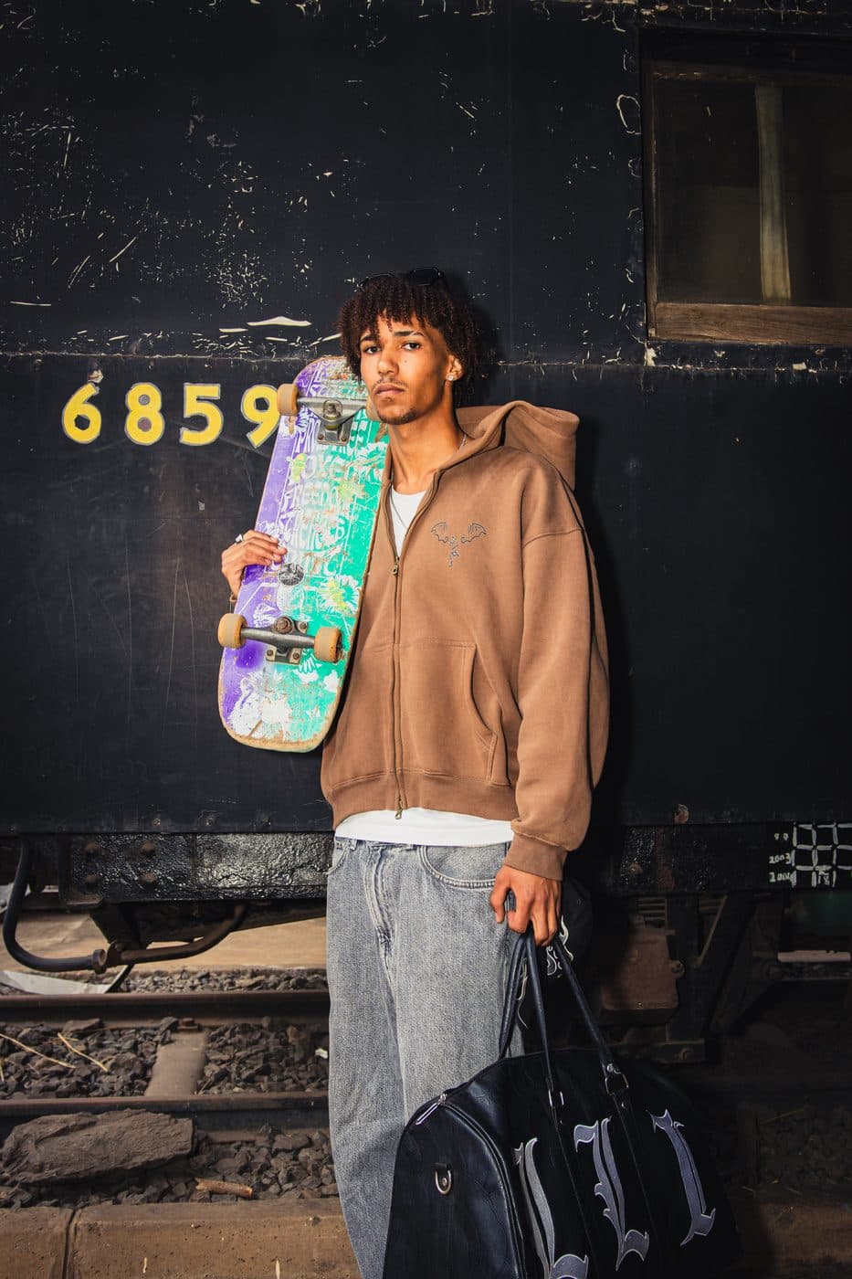 Zip hoodie and board beside wagon 6859