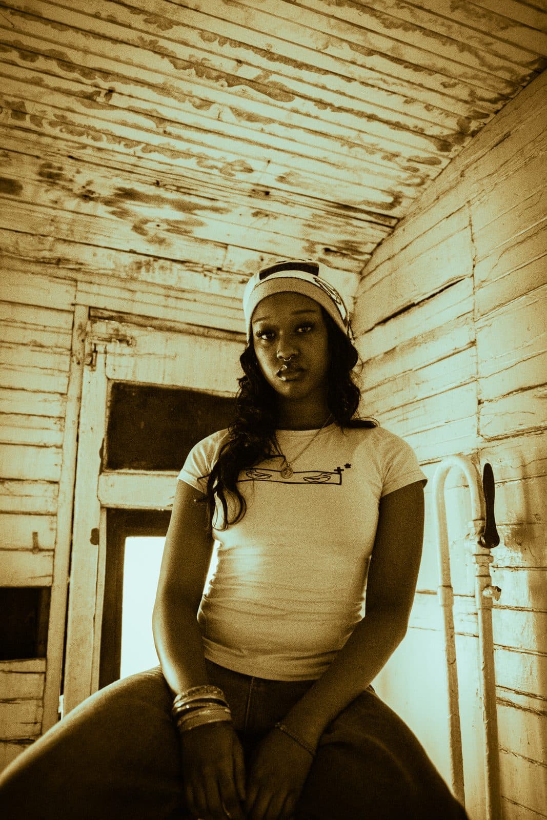 Fitted bone baby tee, shot in the carriage interior